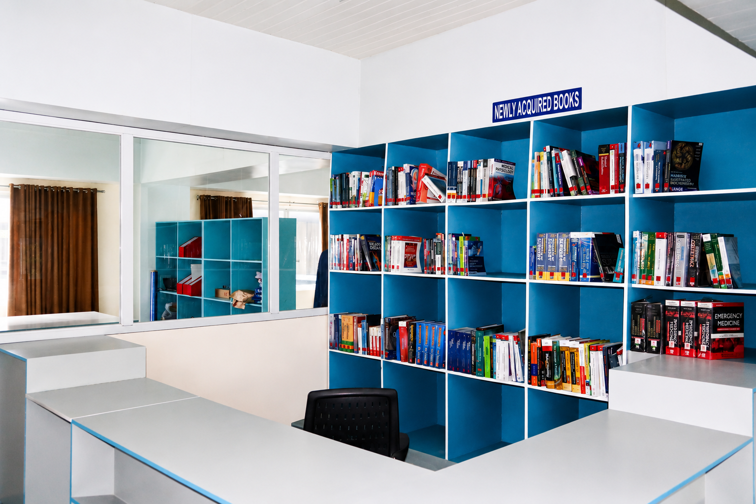 New library containing shelves of books and computer study desks